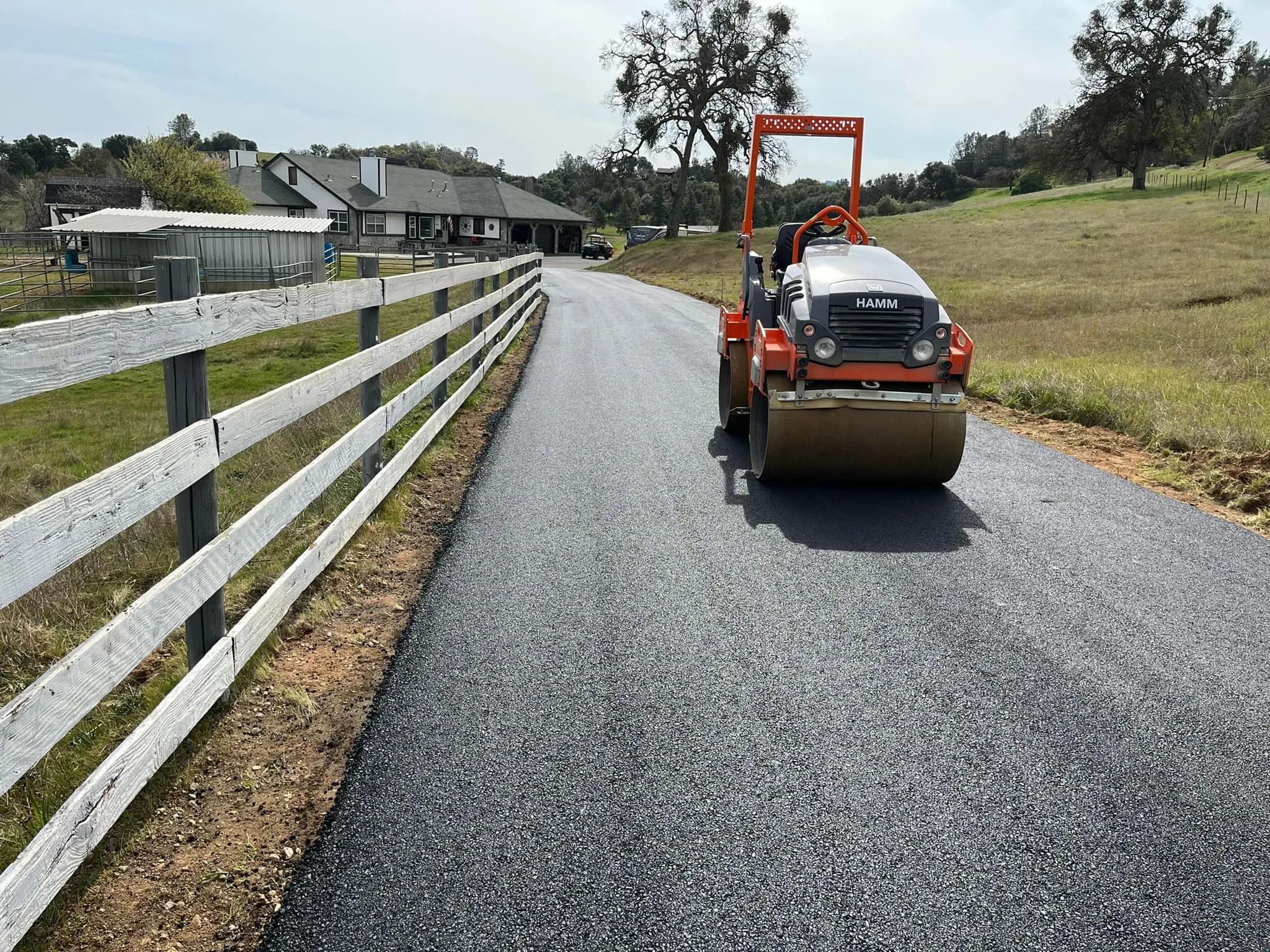 Roller compacting an asphalt surface