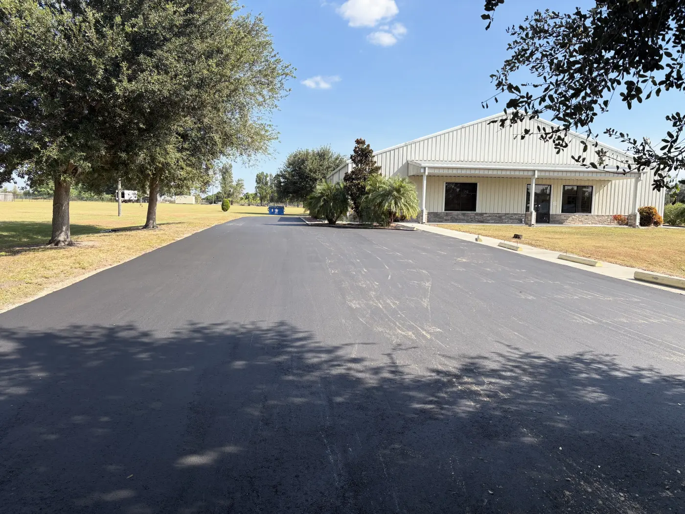 Commercial asphalt parking area after paving
